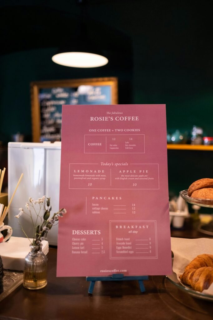 A cozy café setup highlighting a detailed menu display with pastries and warm ambiance.